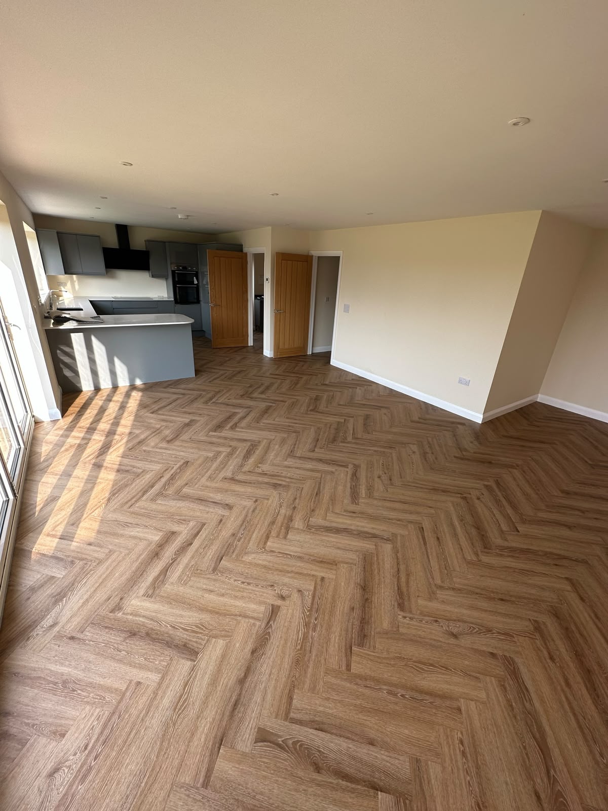 Herringbone LVT in an open-plan kitchen and living space