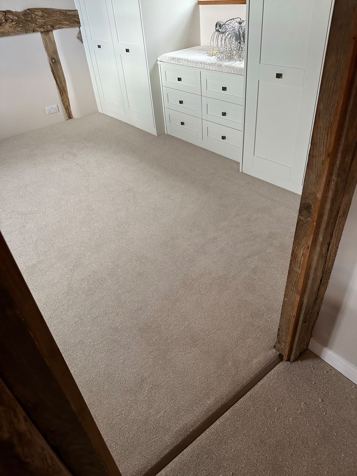 Beige carpet fitted in a bedroom
