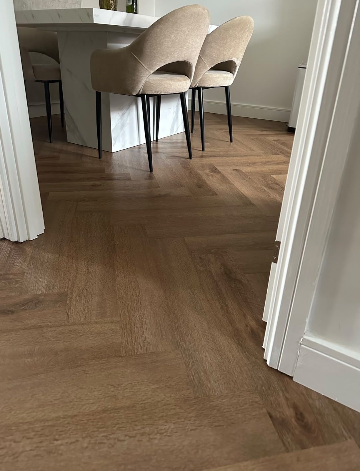 Wood-effect LVT flooring in an open-plan dining space