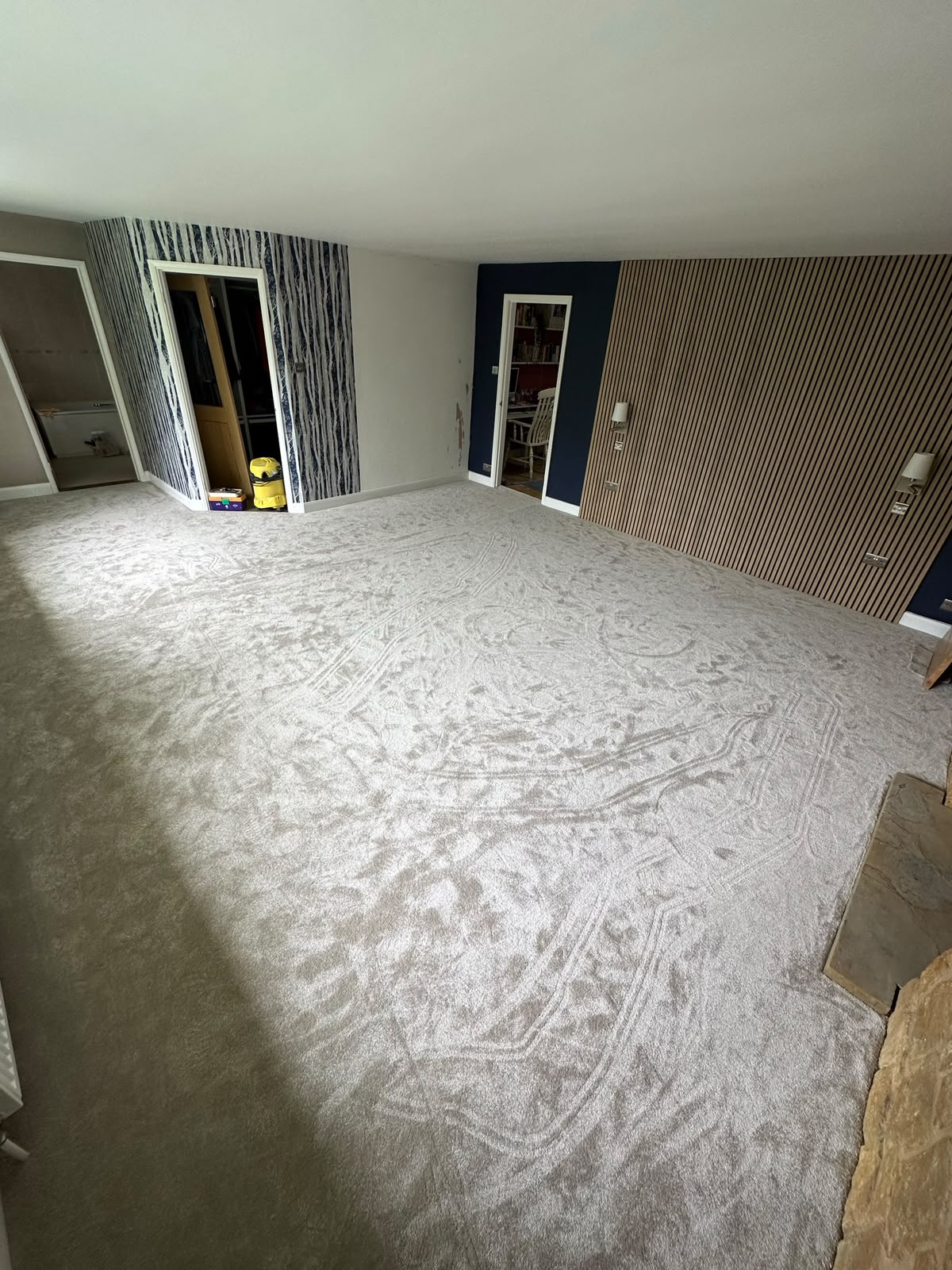 Cream carpet fitted in a newly decorated living room